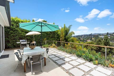 This outdoor area is perfect for enjoying a delightful BBQ under the sun umbrella or savoring some drinks as the sun sets.