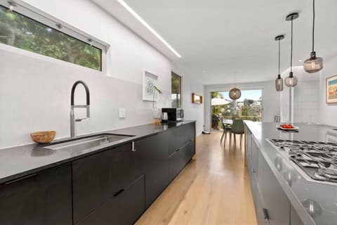The kitchen extends to a dining area, providing a seamless and comfortable transition between the two spaces.