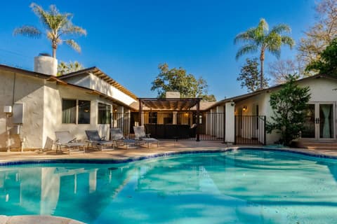 Exclusive heated pool, complemented by an outdoor seating space, perfect for entertaining and unwinding.