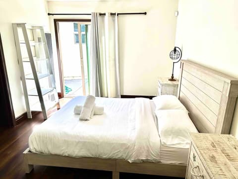 Master bedroom with a queen-size bed, en-suite bathroom and spacious closet.