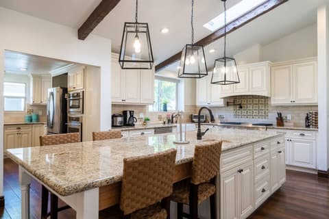 Beautiful contemporary kitchen, fully equipped with a refrigerator and oven for preparing delicious meals during your stay.