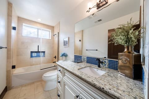 Spacious bathroom featuring a luxurious soaking tub and fantastic natural lighting.
