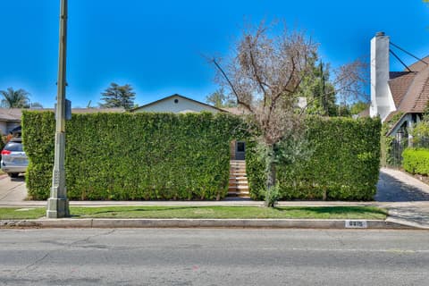 Stunning entrance enveloped by an enchanting garden to capture your heart.