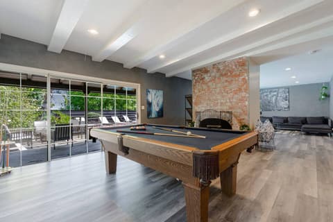 Billiard table for entertaining fun times.