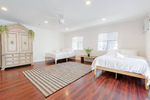 Spacious and welcoming guest room with two comfortable single beds for your convenience.