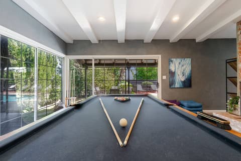 Billiard table for entertaining fun times.