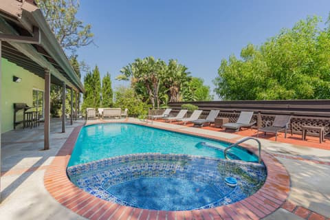 An extensive garden with a magnificent, deep pool, inviting our guests to unwind in serenity and have fun, all while relishing stunning sunset vistas.