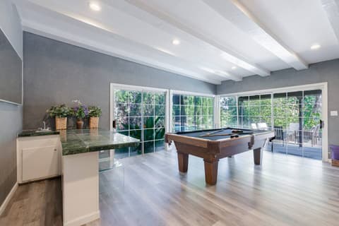 Generously sized living area perfect for entertaining with billiards or cozying up to the fireplace for warmth.