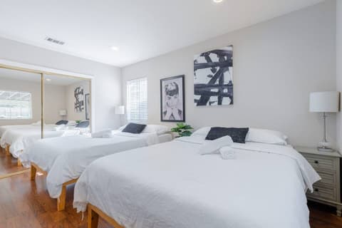 Generous and inviting guest room featuring two comfortable single beds for your comfort.