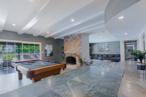 Generously sized living area perfect for entertaining with billiards or cozying up to the fireplace for warmth.