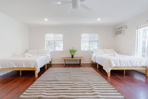 Generous and inviting guest room featuring two comfortable single beds for your comfort.