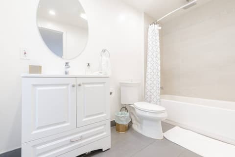 Expansive bath with a soaking tub and fantastic natural illumination.