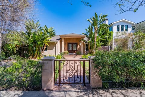 Entrance featuring a convenient garage for your vehicle's parking needs.