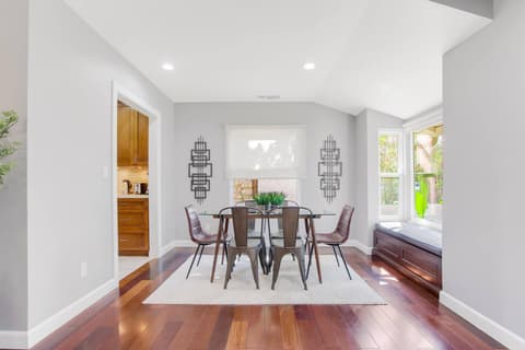 Expansive dining space with breathtaking outdoor views, ideal for hosting memorable meals and gatherings with family and friends.