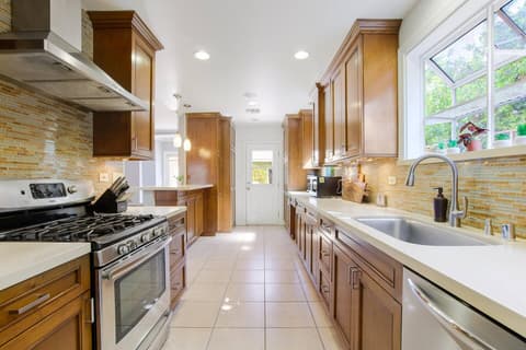 Gorgeous modern kitchen, fully stocked with a fridge and oven for crafting delectable meals throughout your visit.