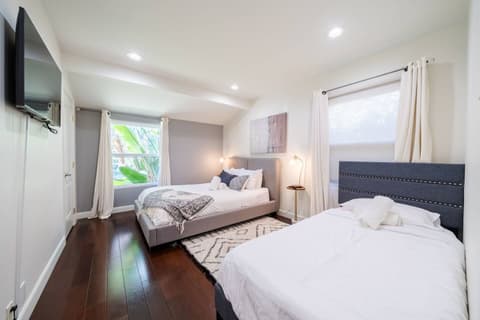 Spacious and welcoming guest room with two comfortable single beds for your convenience.