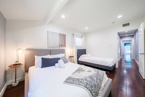 Spacious and welcoming guest room with two comfortable single beds for your convenience.