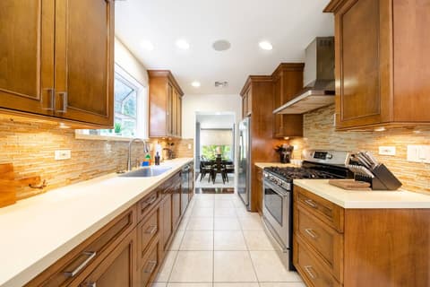 Gorgeous modern kitchen, fully stocked with a fridge and oven for crafting delectable meals throughout your visit.